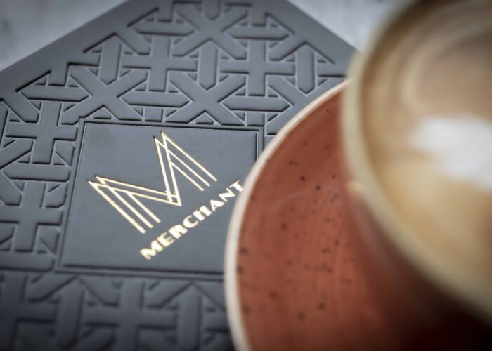 Merchant Cafe logo with coffee